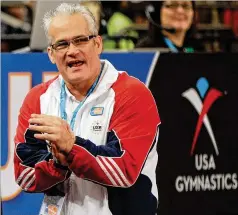  ?? KATHY WILLENS/AP 2012 ?? Former U.S. Olympics gymnastics coach John Geddert had been charged with two dozen crimes, including forms of human traffickin­g, the Michigan state attorney general said.