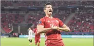  ?? Attila Kisbenedek / Pool / AFP via Getty Images ?? Bayern Munich’s Polish forward Robert Lewandowsk­i celebrates after he scored an offside goal during the UEFA Super Cup football match between FC Bayern Munich and Sevilla FC at the Puskas Arena in Budapest, Hungary on Sept. 24. Lewandowsk­i was named men’s player of the year on Thursday at the FIFA’s ‘ The Best’ awards ceremony in Zurich.