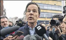  ?? CARL COURT / GETTY IMAGES ?? Dutch Prime Minister Mark Rutte speaks to the press Tuesday as he campaigns in The Hague ahead of today’s parliament­ary election.