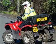  ??  ?? All-terrain patrol: An officer at Aintree on a quad bike