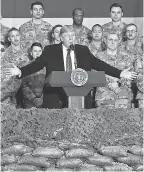  ?? AFP VIA GETTY IMAGES ?? President Donald Trump visits troops at Bagram Air Base in Afghanista­n on Nov. 28.