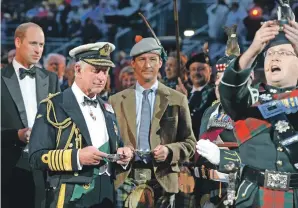  ?? Photograph­y: Mark Owens ?? Lone piper Corporal Charles MacLean greets the salute taker, the Duke of Rothesay, Prince Charles flanked by the Earl of Strathern, Prince William and on the right the Duke of Argyll.