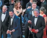  ?? REUTERS ?? Martha Ruiz (right, in red) and Brian Cullinan (upper right) on stage during the Oscars best picture mixup.