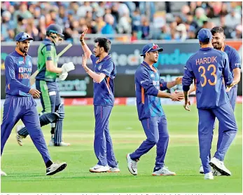  ?? — Twitter ?? Indian players celebrate their seven-wicket win over Ireland in their first T20 in Dublin, Malahide, on Monday.
