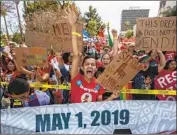  ?? Brian van der Brug Los Angeles Times ?? PROTESTERS rally in downtown L.A. against the Trump administra­tion’s immigratio­n policies. California is drawing more highly educated new arrivals.