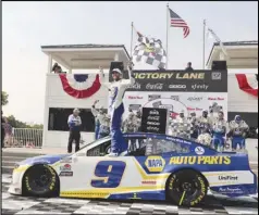  ?? Associated Press ?? LUCKY SEVEN — Chase Elliott (9) celebrates his victory in a NASCAR Cup Series race on Sunday at Road America in Elkhart Lake, Wis. Elliott has seven career Cup Series victories on road courses, putting him in sole possession of third place in NASCAR history.