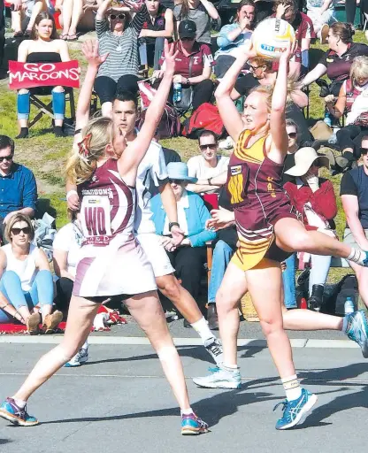  ??  ?? Above: Drouin WA Christie Edwards flies like a ballerina to take the ball ahead of Traralgon’s Kate French. Edwards was one of the fastest on the court.