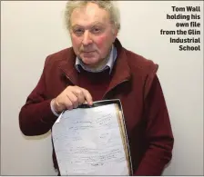  ??  ?? Tom Wall holding his own file from the Glin Industrial School