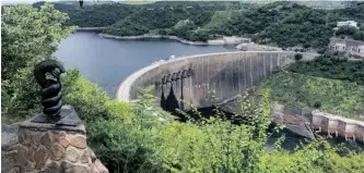  ?? GETTY IMAGES ?? NYAMINYAMI, the river god of the Zambezi, looks out over the Kariba Dam when the lake was fuller.