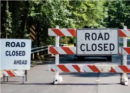  ?? Kirkland SDN) (Photo by Logan ?? Signs block vehicles from crossing a closed bridge on Sturgis-West Point Road. This is one of two immediate bridge closures in Oktibbeha County announced on Monday. The second bridge is located on Moore High Road.