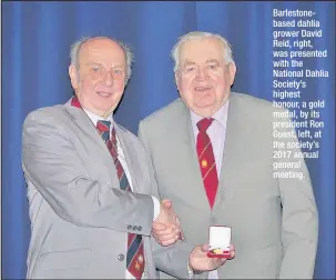  ??  ?? Barlestone­based dahlia grower David Reid, right, was presented with the National Dahlia Society’s highest honour, a gold medal, by its president Ron Guest, left, at the society’s 2017 annual general meeting.