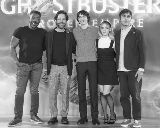  ?? AP ?? ERNIE HUDSON (from left), Paul Rudd, Finn Wolfhard, Mckenna Grace and director Gil Kenan pose for photograph­ers at the photo call for the film Ghostbuste­rs: Frozen
Empire photo call on March 21, 2024 in London.