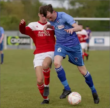  ??  ?? Dylan O’Brien of North End United is challenged by Lee Jordan of Moyne Rangers.