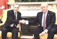  ??  ?? Trump shakes hands with Erdogan during a meeting in the Oval Office of the White House in Washington, DC in this file photo. — AFP photo