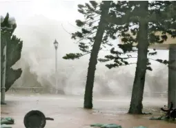  ??  ?? High waves hit the shore at Heng Fa Chuen, a residentia­l district near the waterfront, as Typhoon Mangkhut slams Hong Kong, China, September 16, 2018. (Reuters)