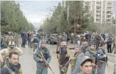  ?? — AFP ?? Afghan security personnel gather after a bomb attack in Kabul.