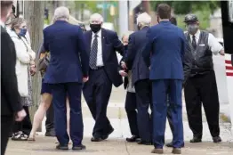  ??  ?? Charles H. Coolidge, Jr., center, arrives with family members to First Presbyteri­an Church for his father’s funeral Friday.