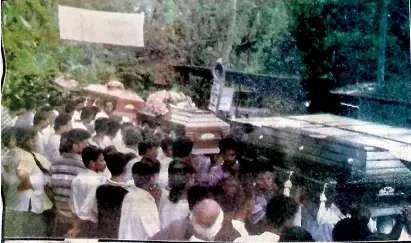  ??  ?? Villagers carry the coffins of the victims of the February 1999 Hokandara gruesome massacre that shocked the nation