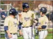  ?? DIGITAL FIRST MEDIA FILE ?? Spring-Ford’s Cam Simmons, center, celebrates with teammates Zach Smiley, left, and David Gulati after the three of them scored a run during a game against Methacton in 2015.