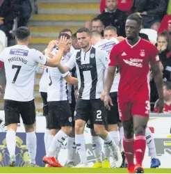  ??  ?? Winners St Mirren won their clash with Aberdeen and both sets of fans were in good spirits