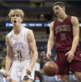  ?? Steph Chambers/Post-Gazette photos ?? Our Lady of the Sacred Heart’s Dante Spadafora and Serra Catholic’s Jimmy Moon react after a basket by OLSH in the WPIAL Class 2A final Friday at Petersen Events Center.