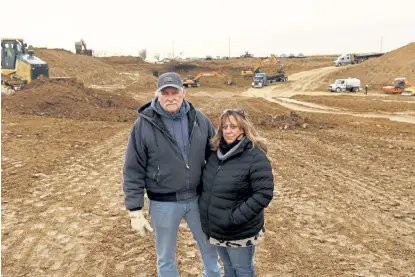  ?? Rachel Ellis, The Denver Post ?? Julie and Mark Nygren stand where their house used to be on their farm at the intersecti­on of County Roads 13 and 42 in Johnstown on Jan. 7. They say their property was ruined by a pipeline leak which also affected their health.