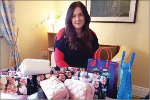  ??  ?? Assembled with Care: Caroline McCarthy pictured with the Care Packs she put together for cancer patients for both Recovery Haven Kerry and Photograph: Marisa Reidy