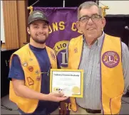  ??  ?? Lions President Dakota McIntire (left) welcomes Melvin Ray Nelms to the Boynton Lions Club.