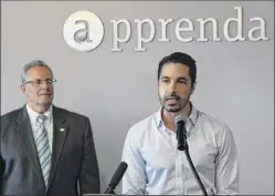  ?? Skip dickstein / times union archive ?? in this 2015 photo, Sinclair Schuller, Ceo, right, is joined by troy’s mayor at the time, Lou rosamilia, for an announceme­nt about Apprenda. the company at one time employed as many as 100 people in troy.