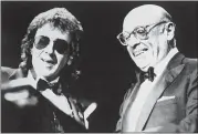  ?? SUSAN RAGAN — THE ASSOCIATED PRESS FILE ?? Legendary record producer Phil Spector, left, laughs with Atlantic Records co-founder Ahmet Ertegun on Jan. 18, 1989 after his induction into the Rock and Roll Hall of Fame at the Waldorf-Astoria Hotel in New York.