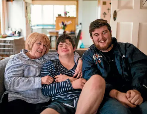  ?? PHOTOS: SIMON O’CONNOR/STUFF ?? Susie Roberts with son Nathan Hartley, 20, who has Down syndrome, and his mate Jayden Crossan, 19.