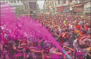  ?? (AP/Anupam Nath) ?? Indians dance during Holi festival celebratio­ns in Gauhati.