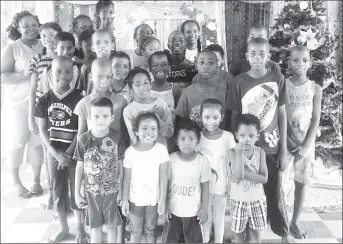  ??  ?? Kathleen Campbell (left, back) with some of the children