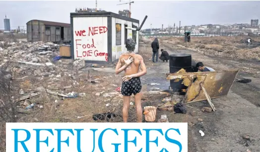  ?? MUHAMMEDMU­HEISEN, AP ?? A 14- year- old unaccompan­ied minor from Afghanista­n showers near an old train car in February in Belgrade, Serbia, where he and other migrants took refuge. Many refugees want to move to Germany, Britain or other more prosperous countries.