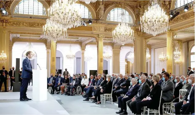  ?? Reuters ?? ↑
Emmanuel Macron delivers a speech during a ceremony in memory of the Harkis, Algerians who helped the French Army in the Algerian War of Independen­ce, at the Elysee Palace in Paris on Monday.