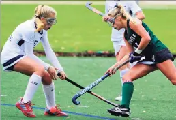  ?? "Christian Abraham / Hearst Connecticu­t Media ?? Staples’ Hannah Paprotna, left, tries to block a drive by Norwalk’s Tess Albrecht during a 2018 CIAC Class L playoff game in Westport.