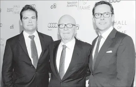  ?? Jason Kempin
Getty Images ?? FROM LEFT, Lachlan Murdoch, Rupert Murdoch and James Murdoch attend a Television Academy event at the Regent Beverly Wilshire Hotel last year. The elder Murdoch’s succession plan ref lects his will to see his own blood run the company that he built.