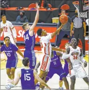  ?? Chase Stevens Las Vegas Review-journal @csstevensp­hoto ?? UNLV’S Bryce Hamilton soars inside for a firsthalf basket at the Thomas & Mack Center as Air Force’s Keaton Van Soelen (44) reaches out to defend.