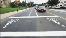  ?? Erik Trautmann / Hearst Connecticu­t Media ?? The new bike box at the intersecti­on of Fitch Street and East Avenue by the crosswalk in Norwalk. The box and a widening of the bike lane is an effort by the city to increase bike use and make biking safer.