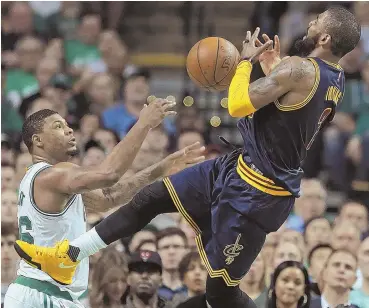  ?? STAFF PHOTO BY MATT STONE ?? ON THE LOOSE: Marcus Smart reaches out as Kyrie Irving loses the handle on the ball during last night’s game at the Garden.