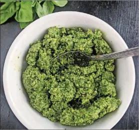  ??  ?? Basil pesto requires no cooking and comes together in minutes in a food processor or blender.