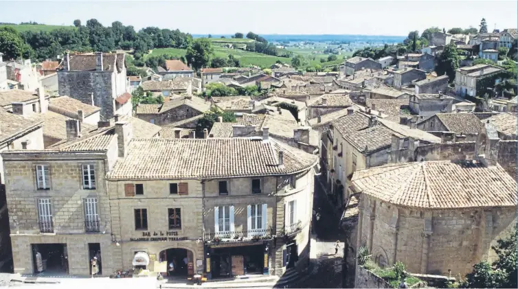  ?? ?? PERFECT SETTING: Above, St Emilion is in the heart of Bordeaux country and has a perfect wine for that Easter meal. Below, the grapes that go to make Rioja, just the match for lamb.