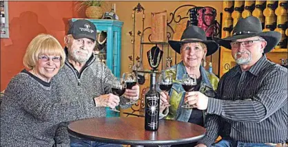  ?? NICK SMIRNOFF / FOR TEHACHAPI NEWS ?? Patty Souza, Bob Souza, Beth Hamilton and Michael Van Atta reflect on the success of Tehachapi Wine and Cattle Company, its tasting room and the area’s designatio­n as a wine region as awarded by the AVA.