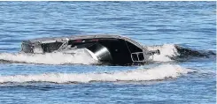  ?? PHOTO: PETER MCINTOSH ?? The boat that capsized trying to traverse the Taieri Mouth bar in September.