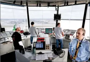  ?? Star Tribune/ ANTHONY SOUFFLE ?? Air traffic controller­s work in the control tower at Minneapoli­s- St. Paul Internatio­nal Airport on April 11. The Trump administra­tion has proposed that the U. S. turn management of the nation’s air traffic control system over to an independen­t group...