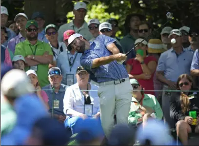  ?? MATT SLOCUM — THE ASSOCIATED PRESS ?? Scottie Scheffler hits his tee shot on the seventh hole during second round at the Masters at Augusta National Golf Club Friday in Augusta, Ga.