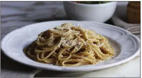  ?? Chicago Tribune/TNS/E. JASON WAMBSGANS ?? Cacio e pepe is a simple, yet glorious pasta traditiona­lly made with the titular cheese and pepper, plus noodles.
