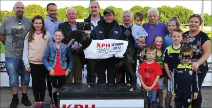  ??  ?? Sponsor Donald Lynch (K.P.H.) presents the winning trophy to Paddy Collins after Melodys Mastro won the KPH Constructi­on Stakes Final All part of the Kerry G.A.A. Race of Champions Finals Night at the Kingdom Greyhound Stadium on Friday night. Included in photo from left, Ivan McCarthy (K.P.H.), Eimear O`Shea, Abbvie Collins, Michael O`Shea (K.P.H.), Moss Leen, Donie Mulvihill, Maurice O`Connor (Trainer), Luke Salmon, Molly Mahony, Lorraine Salmon, Garry Bolyle, Moss &amp; Millie Hughes and Frank Salmon