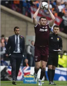  ?? ?? John Souttar takes a throw-in during Hearts’ defeat to Rangers at Hampden