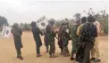  ?? PICTURE: REUTERS ?? FREED: Boko Haram militants embrace and shake hands with Boko Haram prisoners, released in exchange for a group of 82 Chibok girls, who were held captive by Islamist militants, near Kumshe, Nigeria, in May.